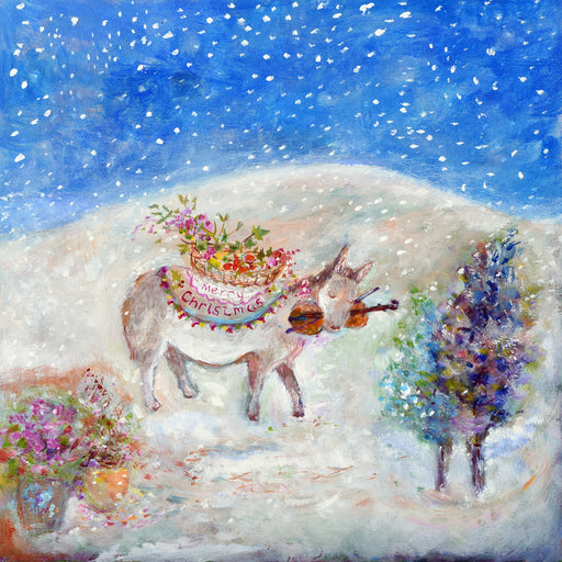 A Christmas Card of a little donkey travelling through a snowy scene with a violin and a basket of Christmas decorations.