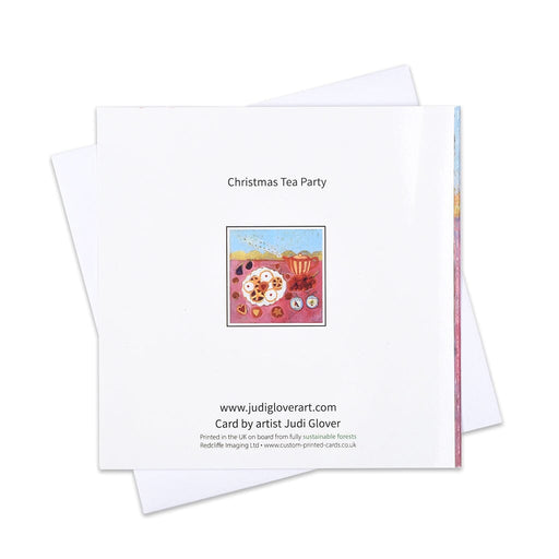 An artistic Christmas card with mince pies, cakes and a teapot on a pink background