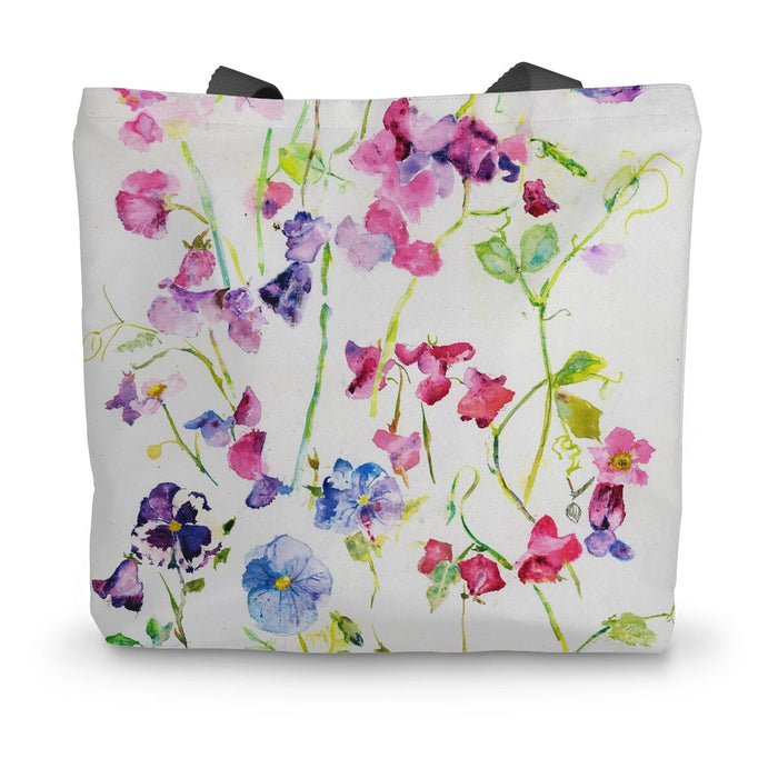 A pretty canvas bag with a sweet peas design making an attractive shopping tote bag