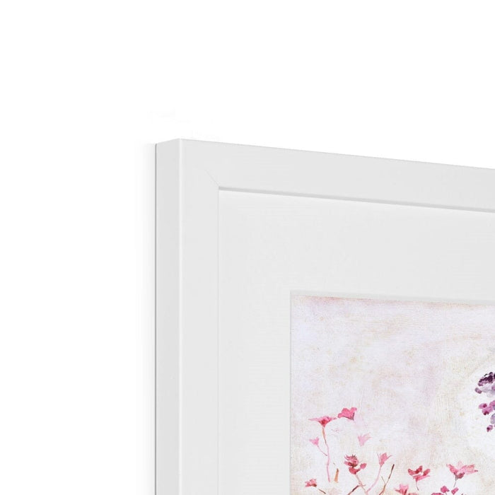 The corner of a framed wall art watercolour showing the white wooden frame and mount. The botanical print is made by Judi Glover Art and would make a pretty floral print for a kitchen