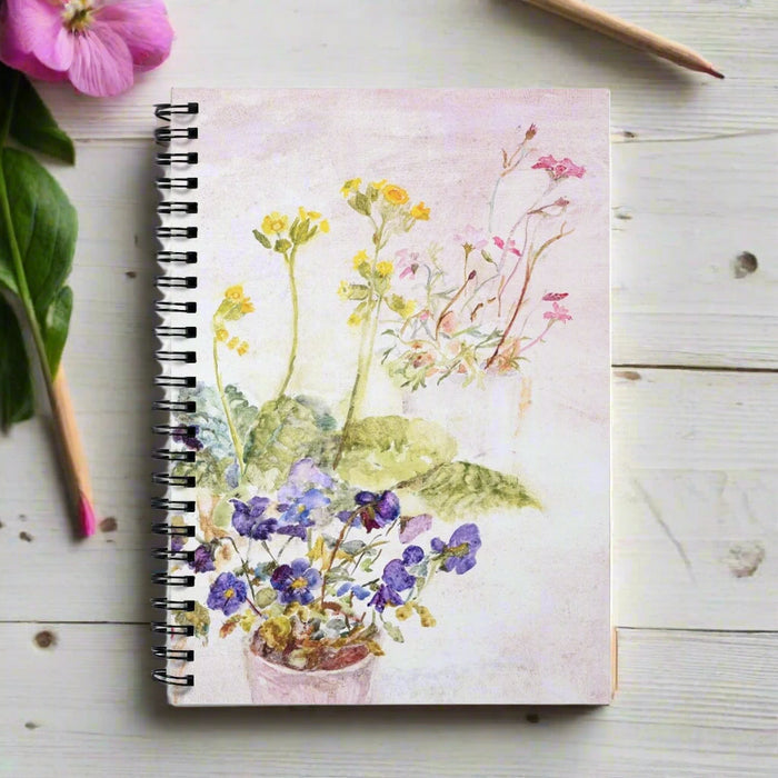 A pretty spiral notebook with a painting of garden flowers on the front. Available as an A5 notebook