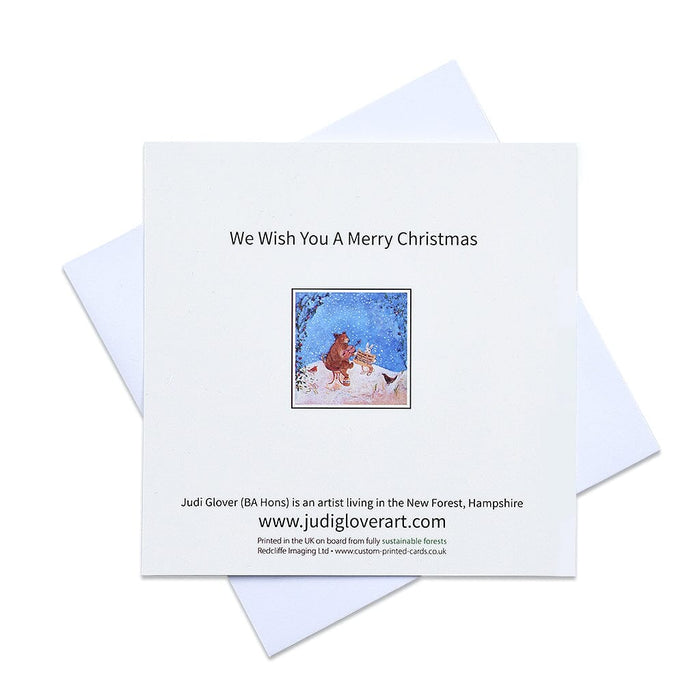 Merry Christmas cards by judi glover art. These cute christmas cards show a bear playing the fiddle with a rabbit and a robin in a snowy christmas scene. The christmas cards are sold in packs of 6