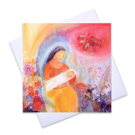 An artistic Christmas card of the nativity  scene of the mother and child in a barn but joyful with flowers and barn animals in the distance.