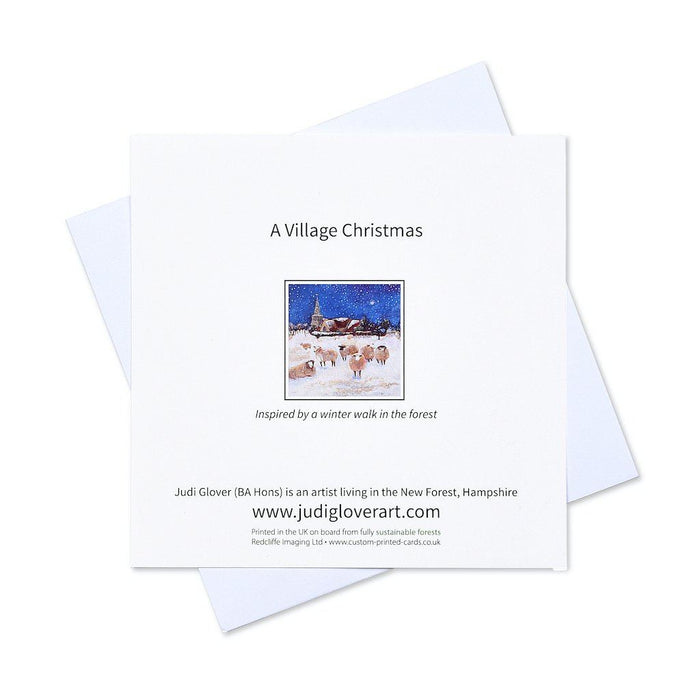 Artistic Christmas cards with a village Christmas and sheep in a field in the snow. The Christimas cards are in a pack of six