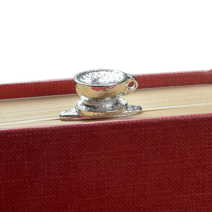 Coffee lover gifts by Judi Glover Art. The bookmark with a coffee cup is shown in a closed book with the coffee cup sitting atop