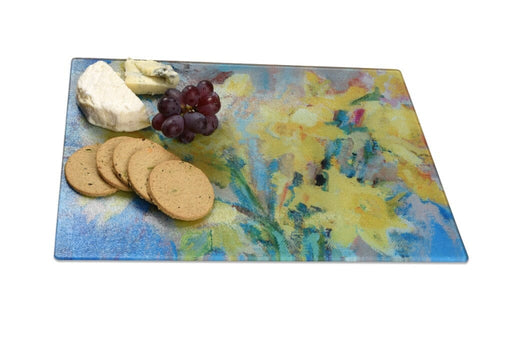 glass chopping board with a daffodil print by Judi Glover Art. The worktop saver would make a pretty housewarming gift