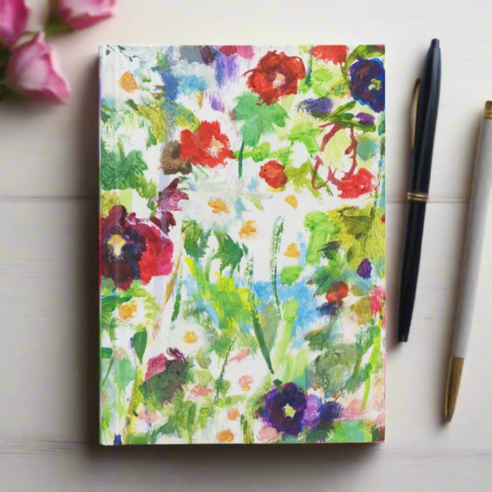 A5 hardback notebook inspired by hollyhocks and daisies. The hardback journal is available as a lined notebook or a plain notebook