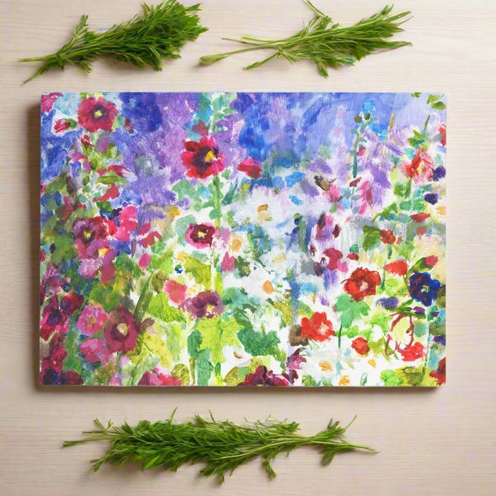 This glass chopping board is made from a painting of vibrant hollyhocks. The worktop saver would make a beautiful and floral gift for cooks