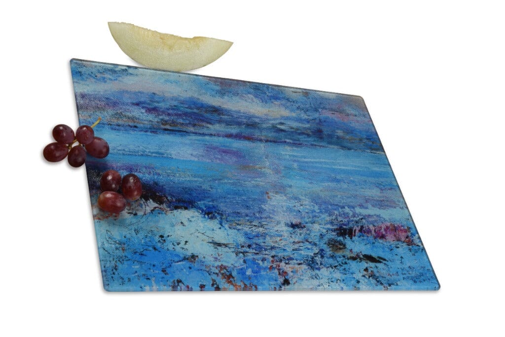 glass chopping board by www.judigloverart.com that can also be used as a worktop protector. The Isle of Mull art worktop saver is blue in colour and shows the colours of the sea