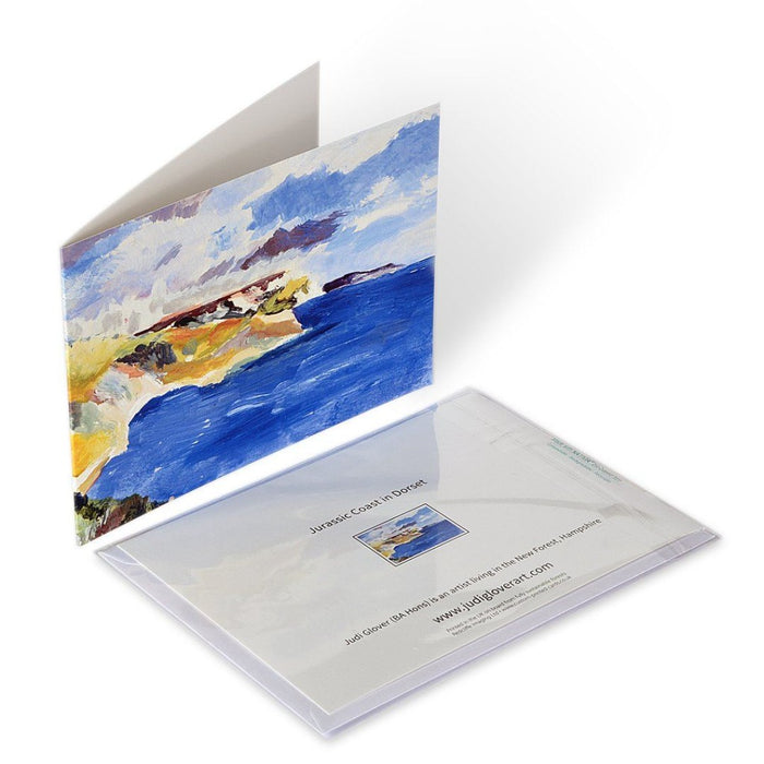 Artistic Greeting Card made from an original painting of the Jurassic Coast in Dorset, UK. Fine Art Greeting Card made by Judi Glover available at Judi Glover Art. The card shows the blue seas of the coast in Dorset along with the cliffs. The card is hand printed and made from sustainable forests.
