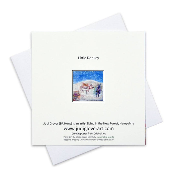 A set of 6 Fine Art Christmas Cards. Little Donkey Christmas Cards made from Original Art. The painting of a little Donkey is by Judi Glover Art. The Fine Art Christmas Card shows a Donkey in a Christmas Setting with snow falling.