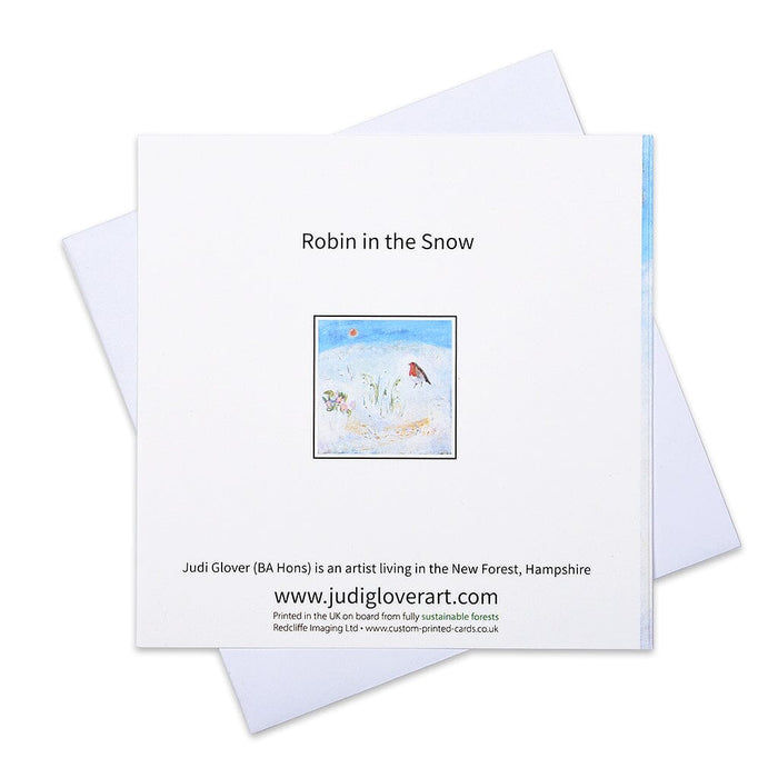 Robin Christmas cards from Judi Glover Art showing a robin in the snow amongst snowdrops. The luxury Christmas cards are made in the UK and are blank inside in packs of 6