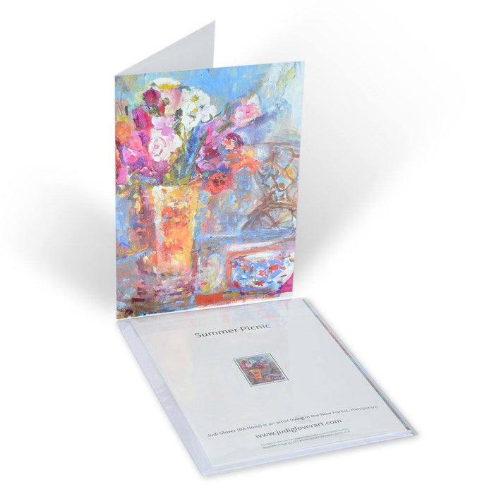 Fine Art Card made from original painting of flowers in a vase on a table with a chair in the background. Available from Judi Glover Art