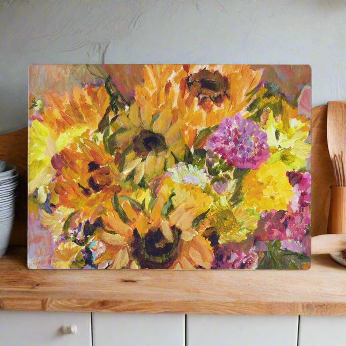 This versatile glass chopping board or worktop saver by Judi Glover Art with a sunflower pattern will brighten and protect kitchen surfaces. Can be used as a glass chopping board or a present for mum