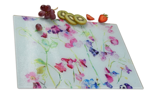 A glass chopping board from Judi Glover Art that can be used as a worktop Saver. This kitchen gift has sweet peas an image of pretty sweet peas  makeing a perfect decorative kitchen gift