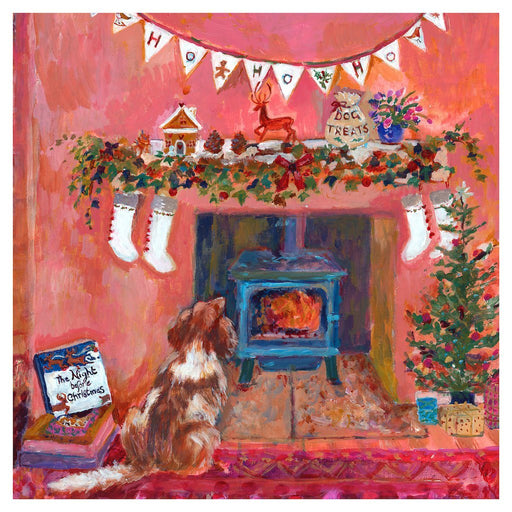 Christmas decor and Christmas print by Judi Glover Art showing a spaniel sitting by the fireplace on the night before Christmas. The Christmas wall art shows stockings, gingerbread house and ivy