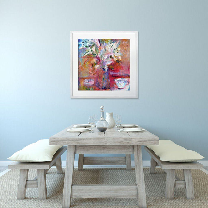 Floral Art Prints showing a large bunch of lilies in a vase on a table with a red background. The Wall Art Lilies are available from Judi Glover Art in a range of sizes and can be framed
