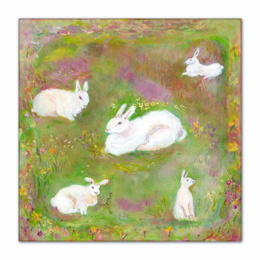 Child's wall canvas art of a little group of white rabbits in a meadow full of wild flowers available at www.judigloverart.com. Perfect for little imaginations!