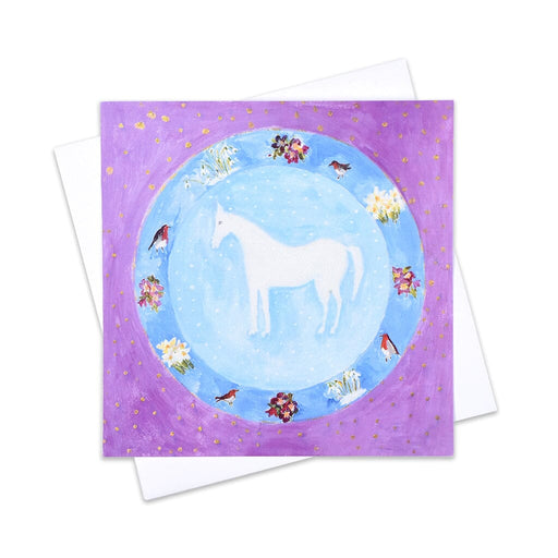 An artistic Christmas card of white horse surrounded by winter flowers and robins