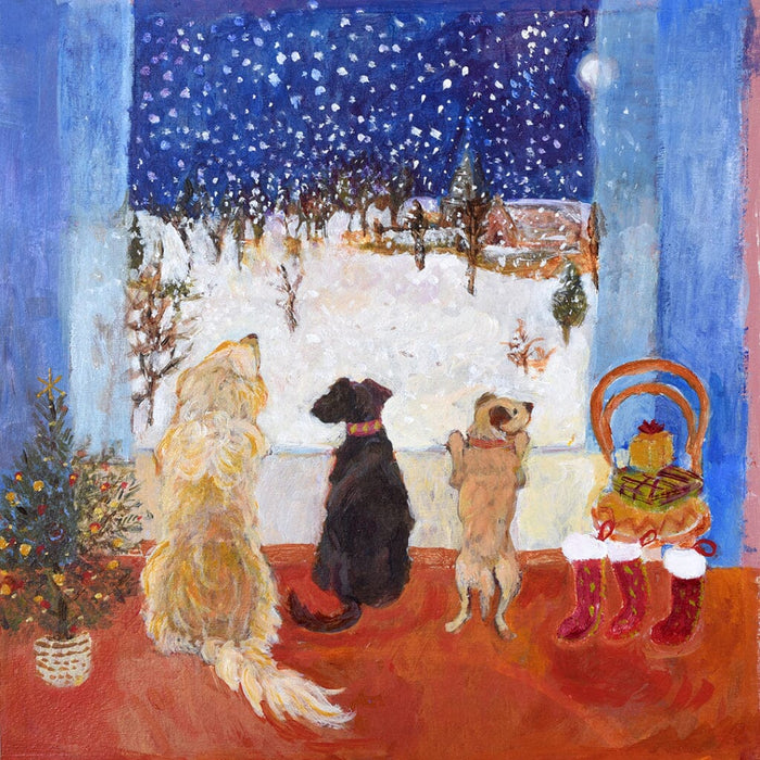 A unique Christmas card of 3 dogs looking out onto a snowy scene and eagerly waiting for Christmas
