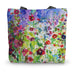 A summer canvas bag with a print of summer flowers hollyhocks and daisies 