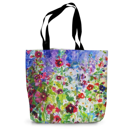 A canvas tote bag that makes a perfect summer holiday bag with a pretty floral print on sturdy cotton canvas
