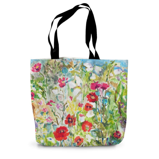 A cotton tote bag made from hard wearing canvas and featuring a pretty  red poppies print