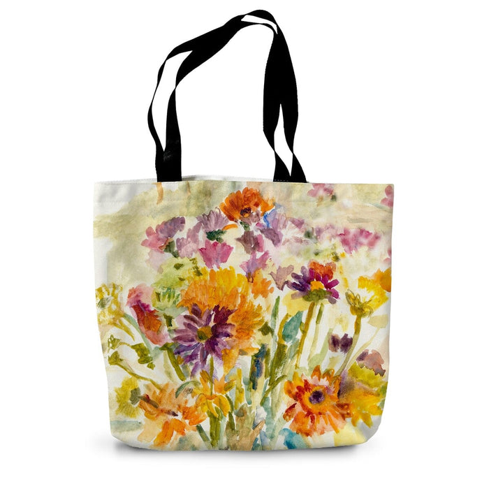 A summer tote bag with a printed flower design on the front and back
