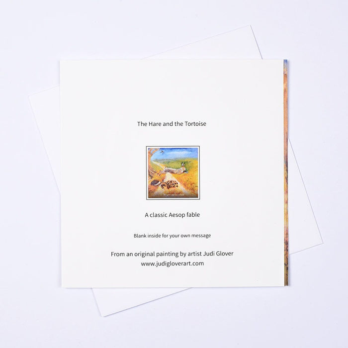 Back of The Hare and the Tortoise greeting card by Judi Glover — blank inside, from an original painting, A classic Aesop fable