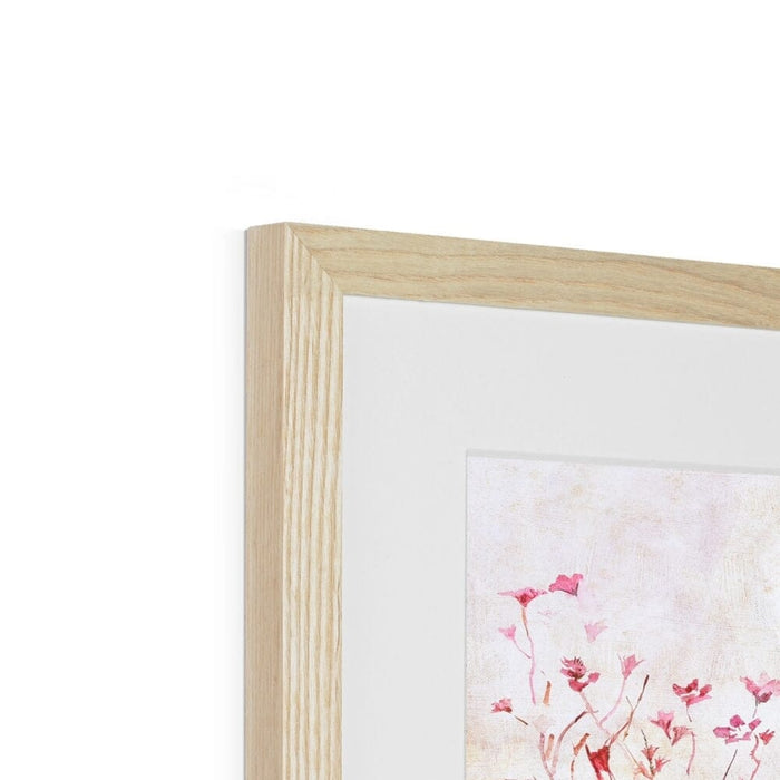 A detail showing a wall art floral print expertly framed in natural wood with a superb mount. The framed art print shows pansies and is made by www.judigloverart.com