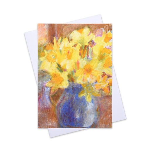 A special card of a happy bunch of daffodils in a blue vase. This art greeting card is made from a painting by Judi Glover Art
