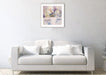 Hydrangea art print by Judi Glover Art shown framed in light grey on a wall above a sofa. The hydrangea print is from paintings by Judi Glover. Each flower print is printed on giclee paper in the UK by hand