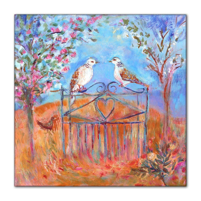 Dove canvas print of two doves perched on a wrought-iron gate and surrounded by flower blossom. The dove canvas art is printed on high quality cotton canvas