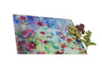 A glass chopping board with colours of blue, red and green. The worktop saver by judi glover art has a print of hollyhocks and is a good gift for cooks