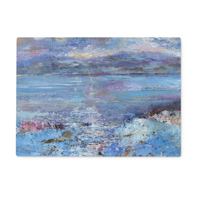 A glass chopping board and worktop saver featuring blue colours of the sea. The worktop protector will add a elegance to kitchen countertops and sideboards