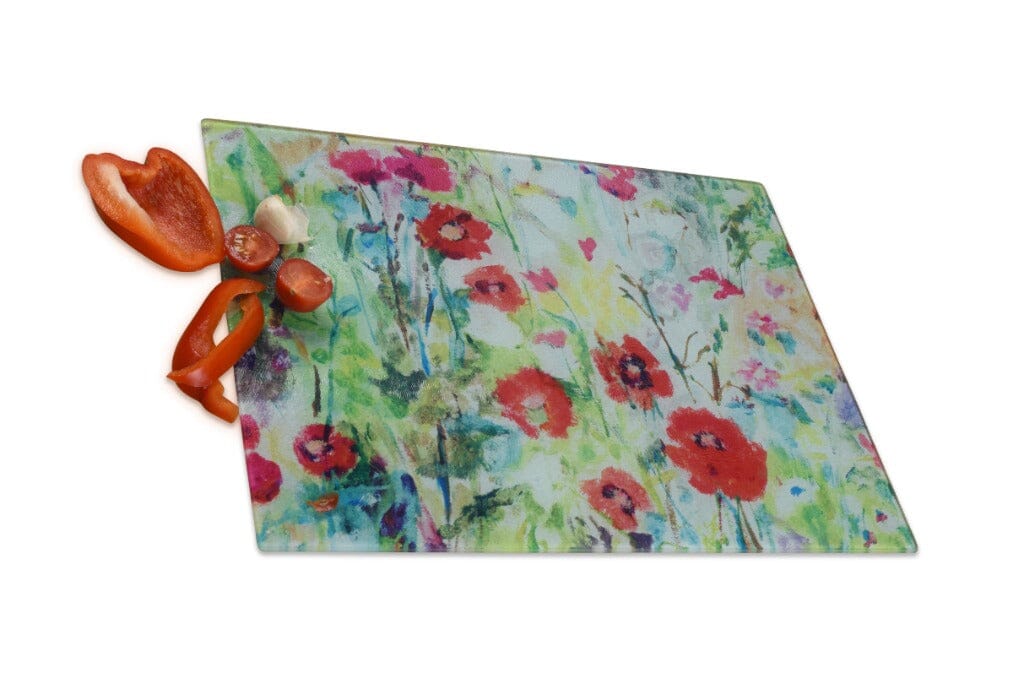 Housewarming present by www.judigloverart.com. The glass chopping board has red poppies and wildflowers and would make a pretty worktop saver