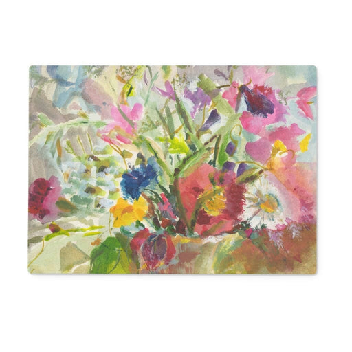 A glass chopping board by Judi Glover Art. This colourful chopping board has a floral design and can be used as a space saver